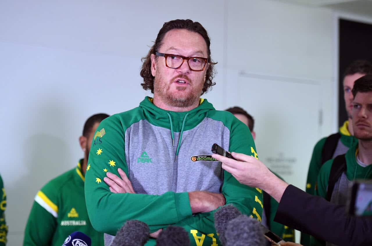 Luc Longley, assistant coach of the Boomers, the Australian national basketball team, speaks to the media as he arrives at Brisbane airport,