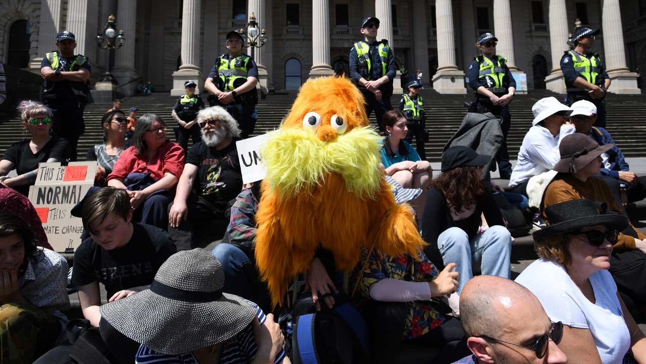 A protester dresses up in a Lorax costume from Dr Seuss in Melbourne.