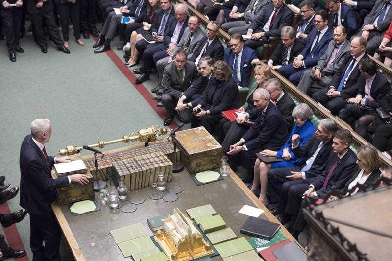 The two leaders face off across the chamber.