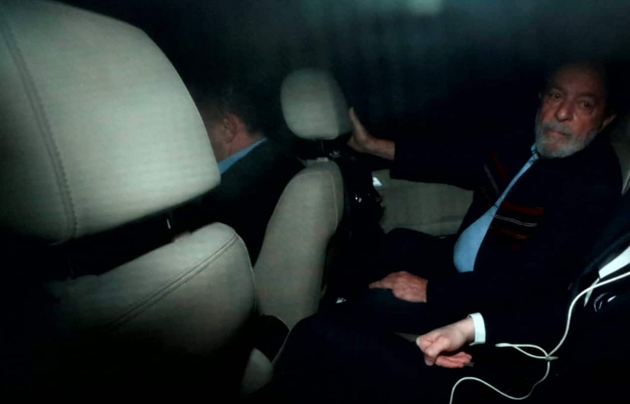 Luiz Inacio Lula da Silva leaves the Lula Institute after a judge issues a warrant for his arrest.