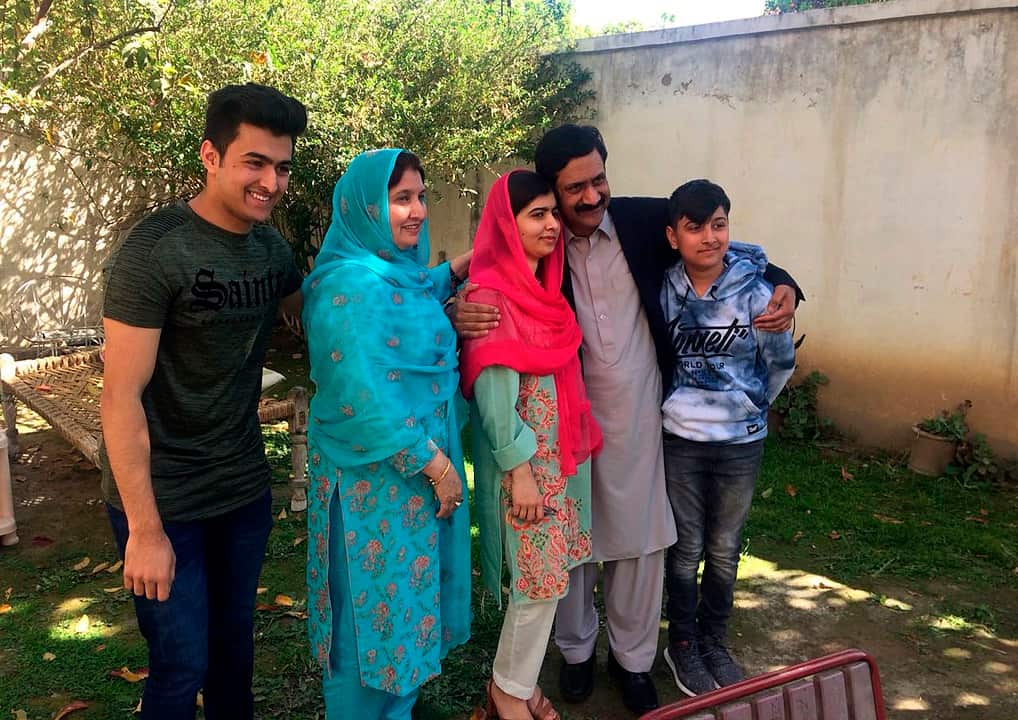 Malala Yousafzai with her family members at her native home during a visit to Mingora.