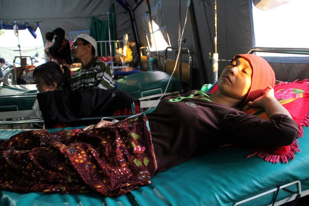 An Indonesian woman is treated for malaria at a village clinic in West Lombok.