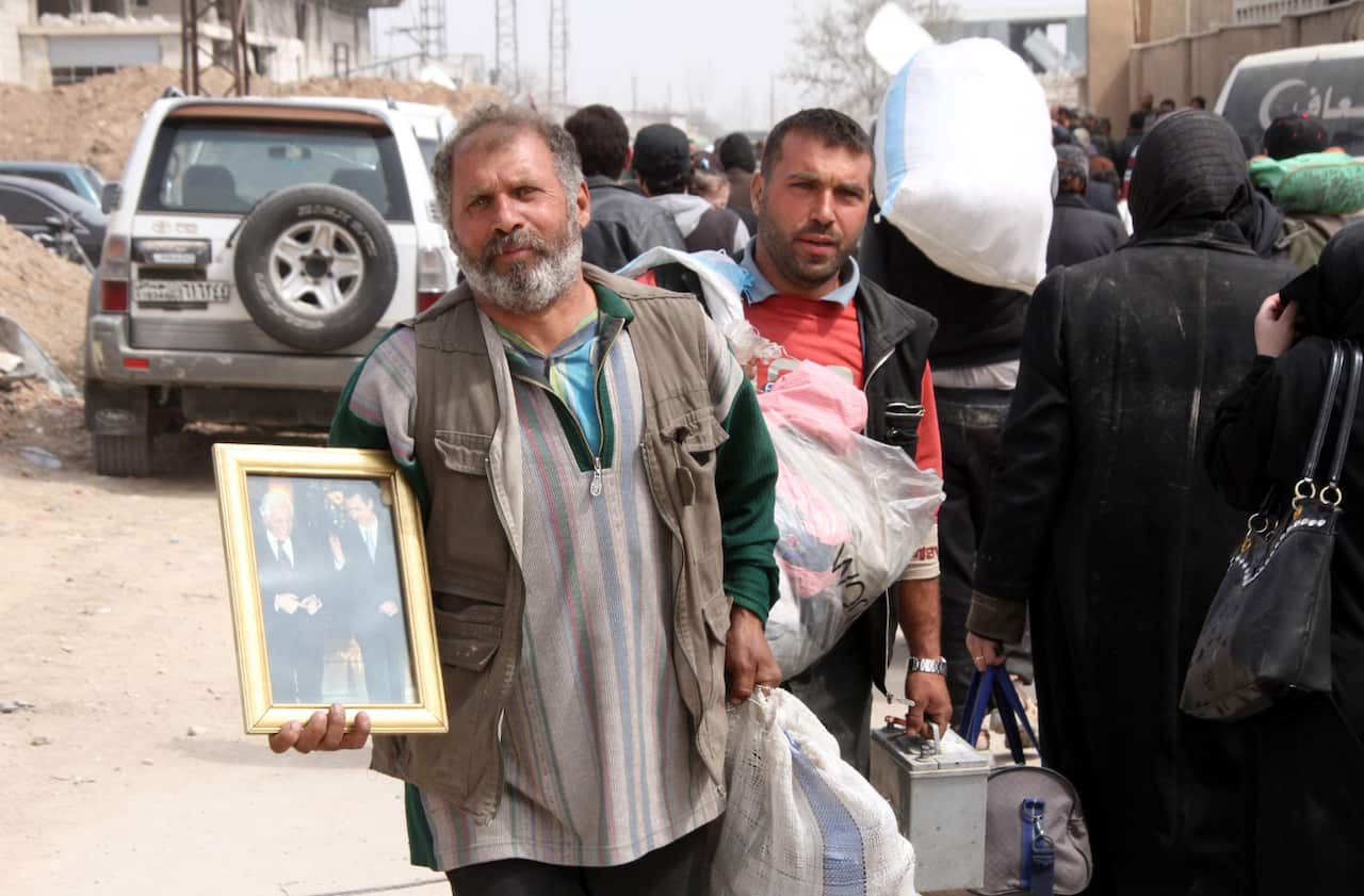Thousands of civilians leave rebels-held Eastern Ghouta with only the possessions they can carry. 