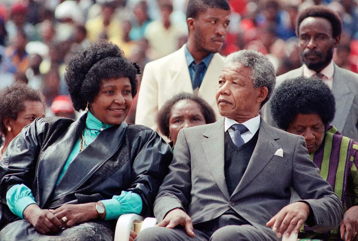 In this Feb. 13, 1990 file photo, Winnie Mandela, left, with her former husband Nelson Mandela, right, at a rally in Soweto, South Africa after his release