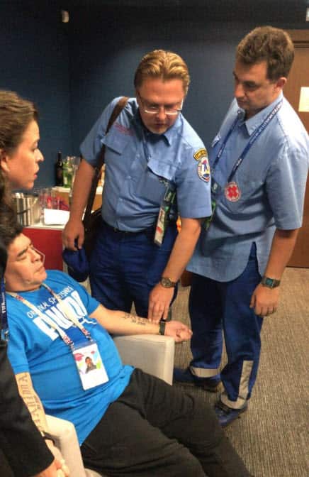 Maradona was photographed being assisted by paramedics after the match