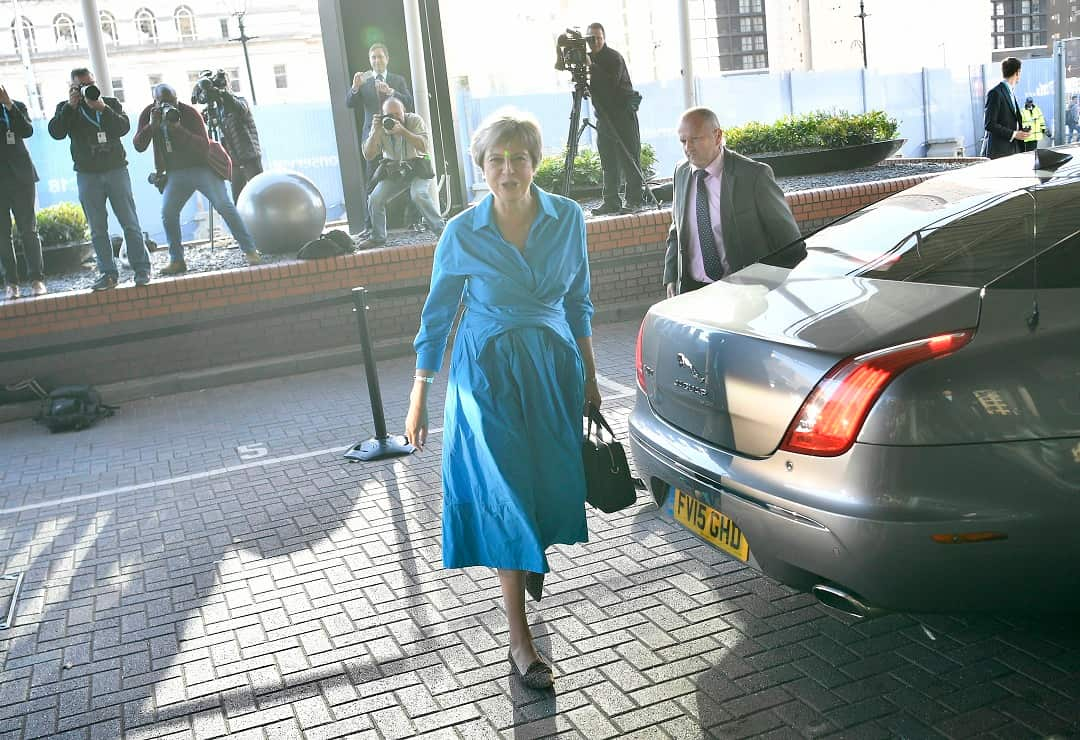 epa07056981 Britain's Prime Minister Theresa May (C) arrives for the Conservative Party Conference at the Hyatt Hotel in Birmingham, Britain, 29 September 2018. The Conference runs from 30 September to 03 October.  EPA/NEIL HALL