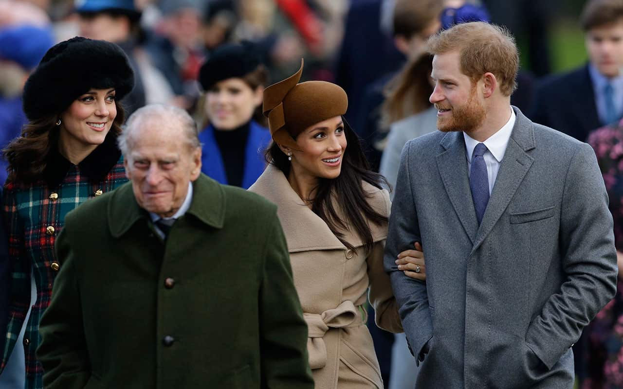 Britain's Prince Harry (R) and his fiancee, US actress Meghan Markle attend the Christmas Day Church Service at St. Mary Magdalene Church.