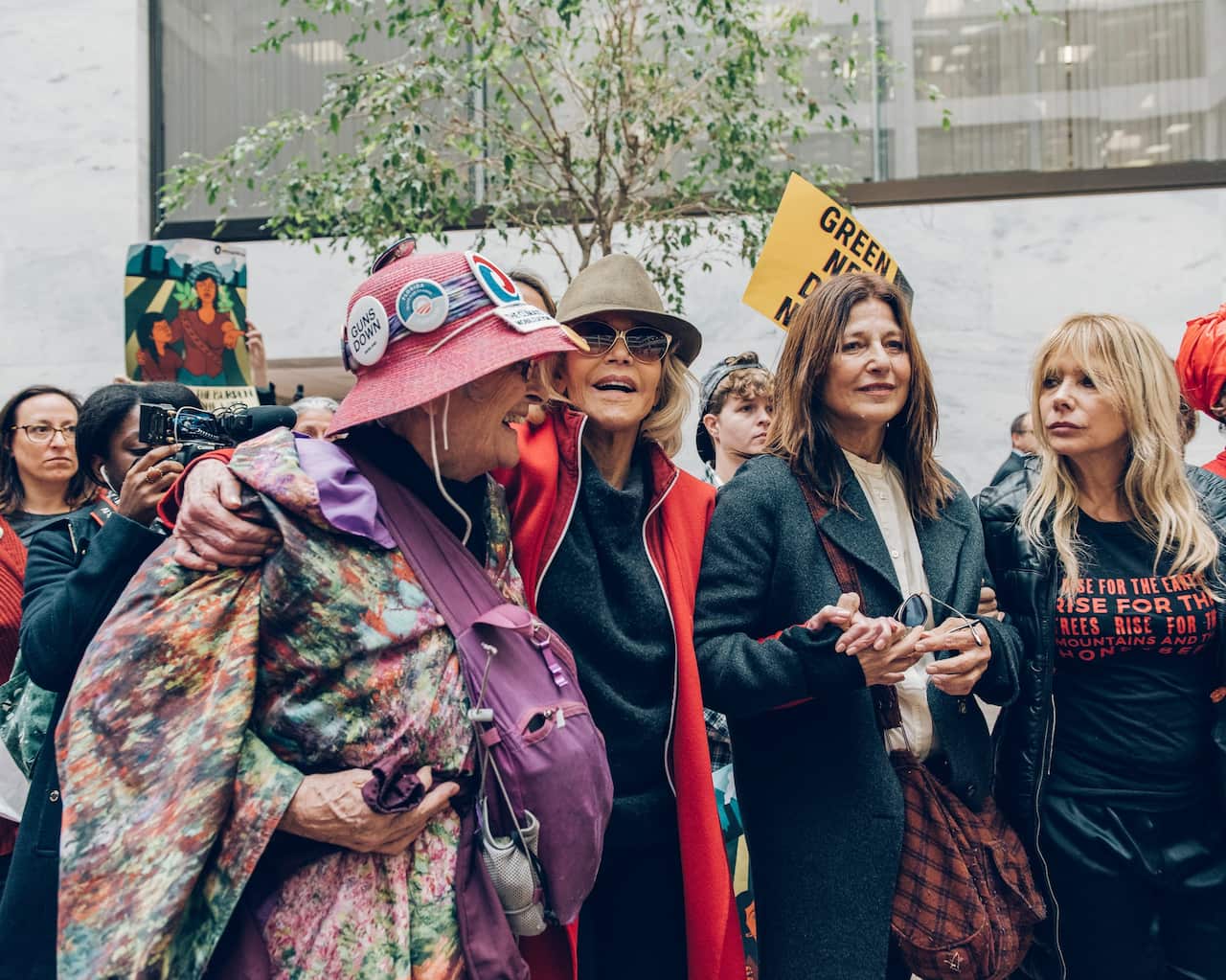 Jane Fonda, in hat and red coat, brought Catherine Keener and Rosanna Arquette, right, to Friday’s protest.