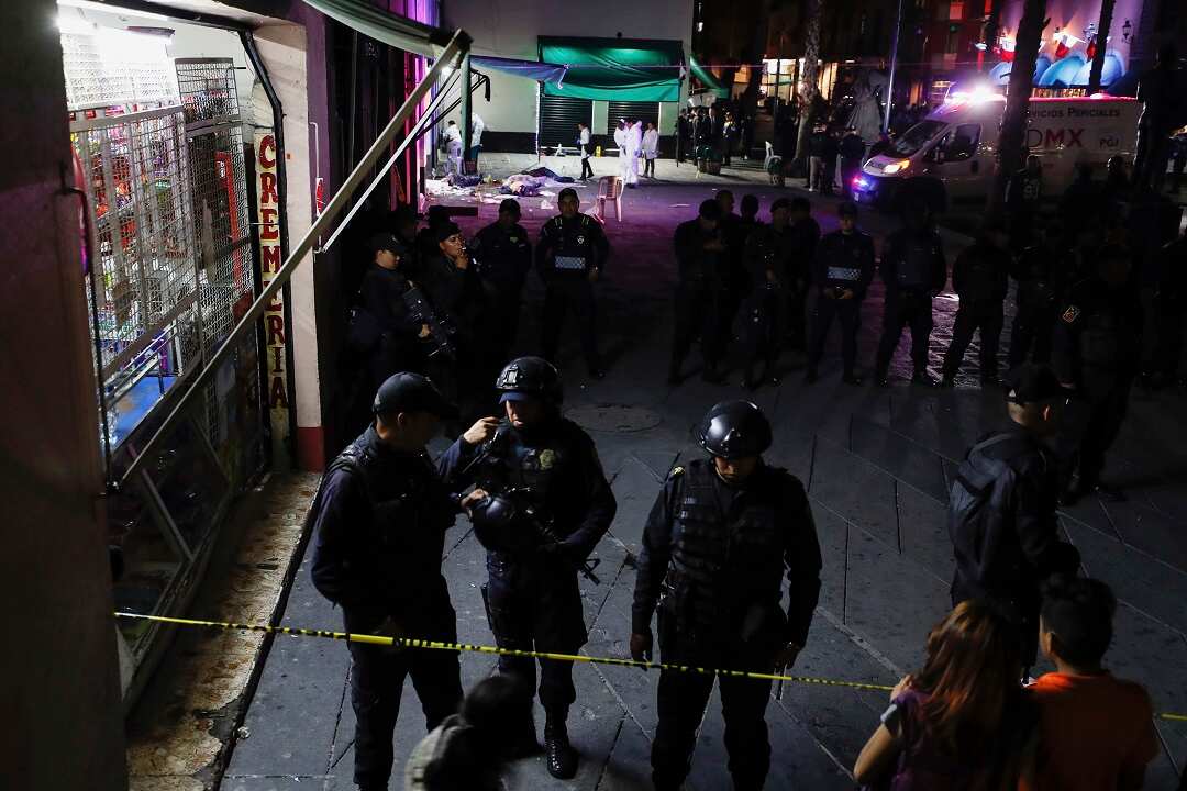 Police block access to a crime scene after a shooting in Plaza Garibaldi in Mexico City.