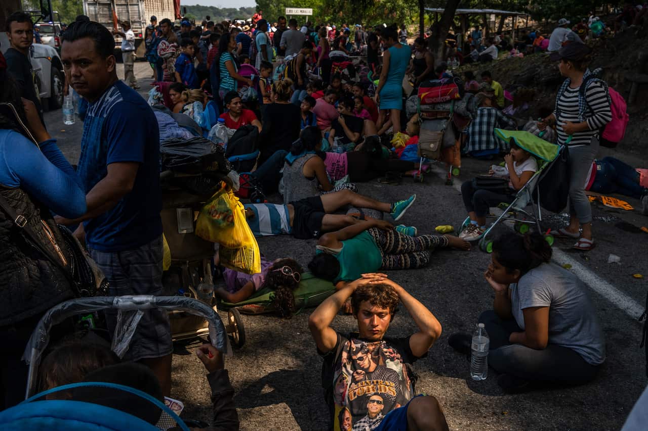 Migrants rest while they make their way through the Mexican state of Chiapas, Mexico, near the town of Huixtla.