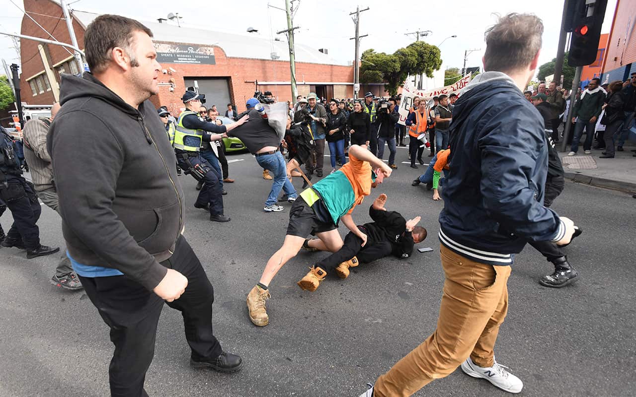 Protesters clash in Kensington, Melbourne on Monday, December 4, 2017. 