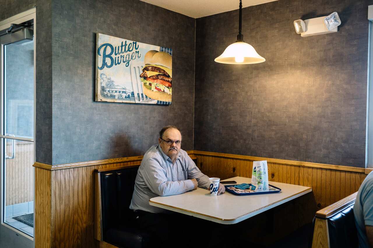 John Palmer on May 16, 2019, at Culver's restaurant in St. Cloud, Minn., where he reads right-wing news and conspiratorial websites each weekday.