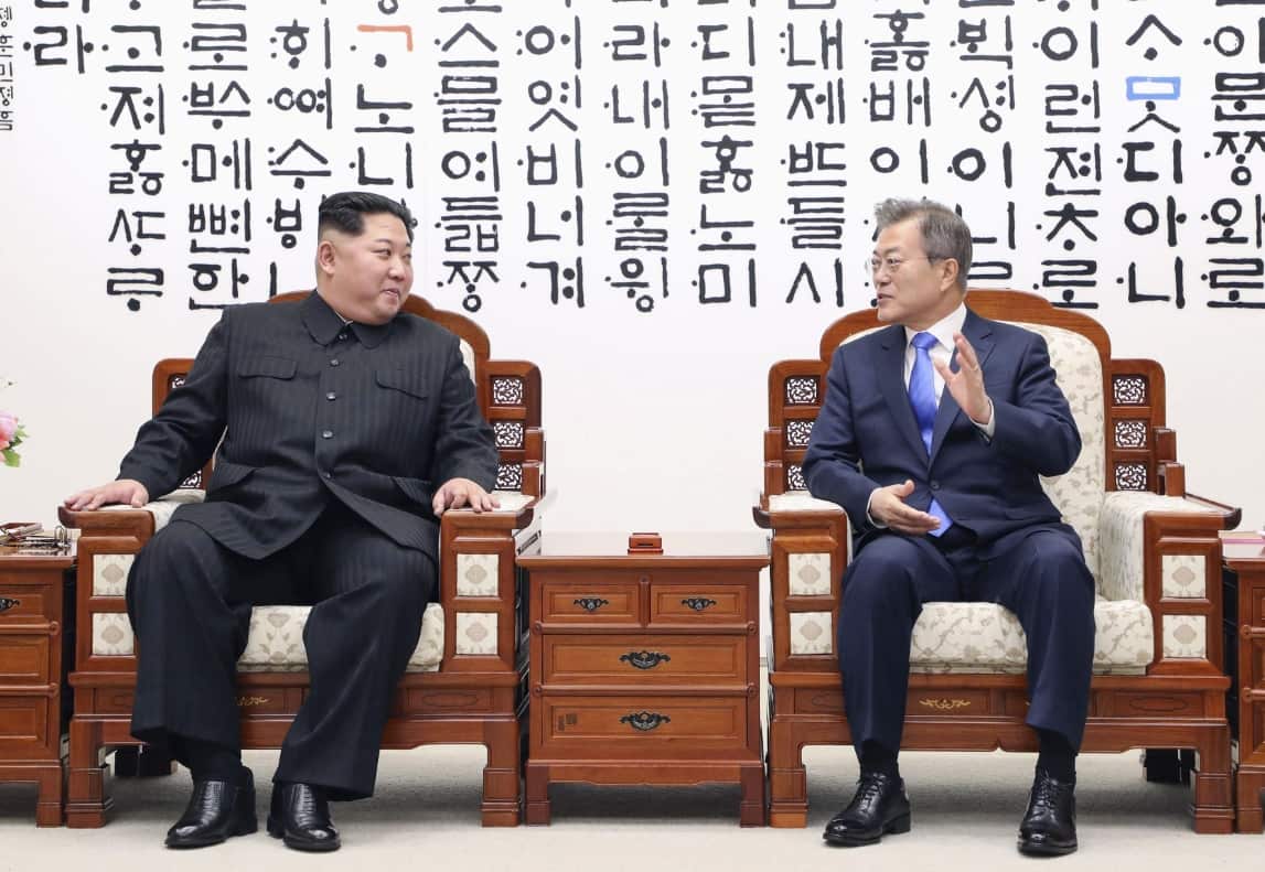 South Korean President Moon Jae In (R) and North Korean leader Kim Jong Un hold talks at the House of Peace in Panmunjeom on April 27, 2018.