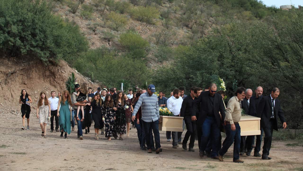 Family and friends mourn the victims of the Mormon community who were attacked by drug traffickers during their funeral in La Mora, Mexico, 7 November 2019.