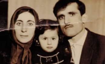 Muradiye aged 3, with her parents. 