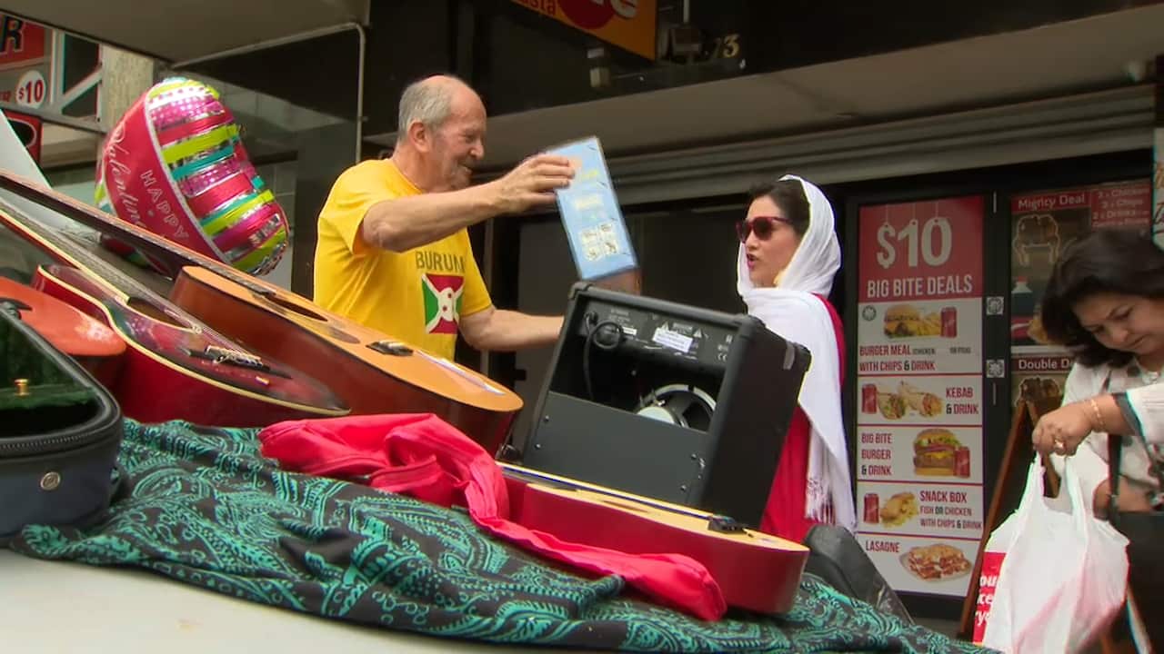 Mr Feinstein hands out instruments in Villawood.