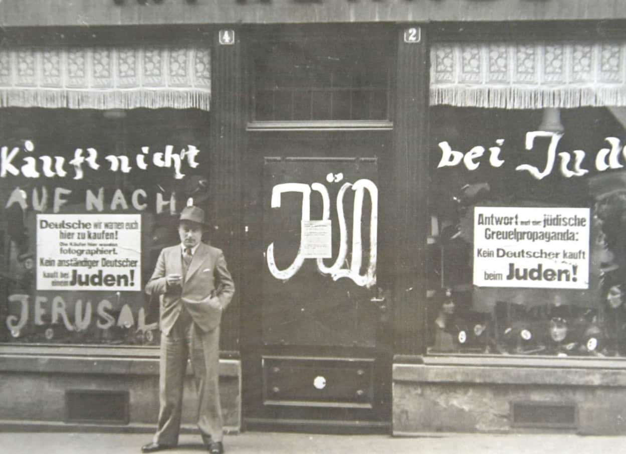 Undated photo of a Jewish store in Vienna with anti-Semitic slogans daubed on walls and store windows. 