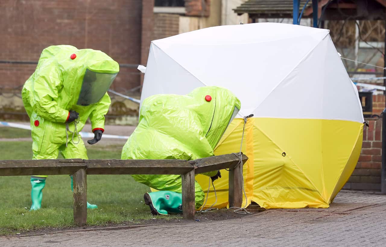 Police in HAZMAT suits as they investigate the poisoning of two people in Salisbury.