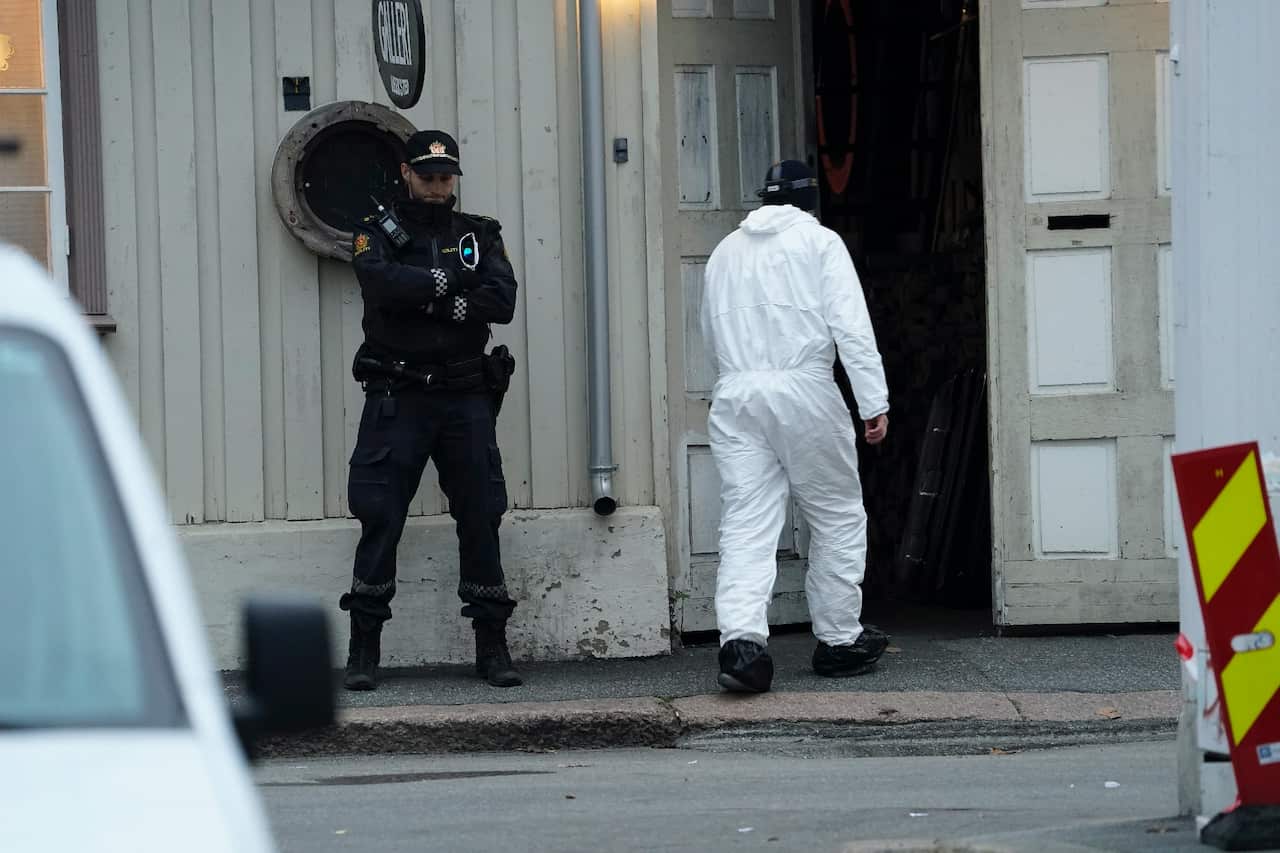 Police investigate sites connected to the attack in Kongsberg, Norway.