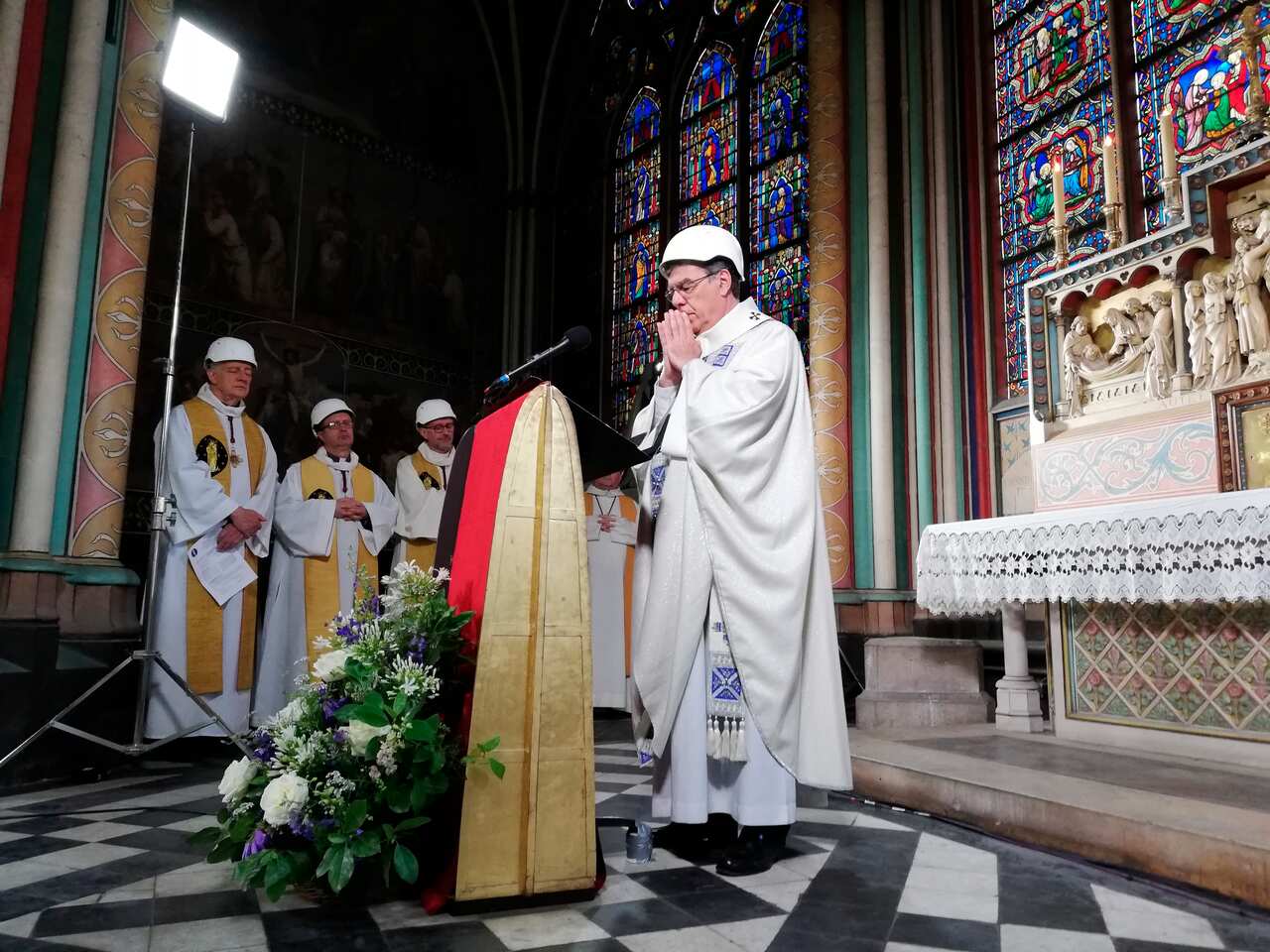 The Archbishop of Paris Michel Aupetit leads the first mass in a side chapel, two months after a devastating fire engulfed the Notre-Dame de Paris cathedral.