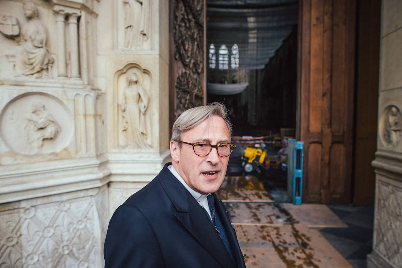 Msgr. Patrick Chauvet, rector of the Cathedral of Notre Dame, speaks outside the medieval structure in Paris on May 3, 2019. (Dmitry Kostyukov/The New York Times)