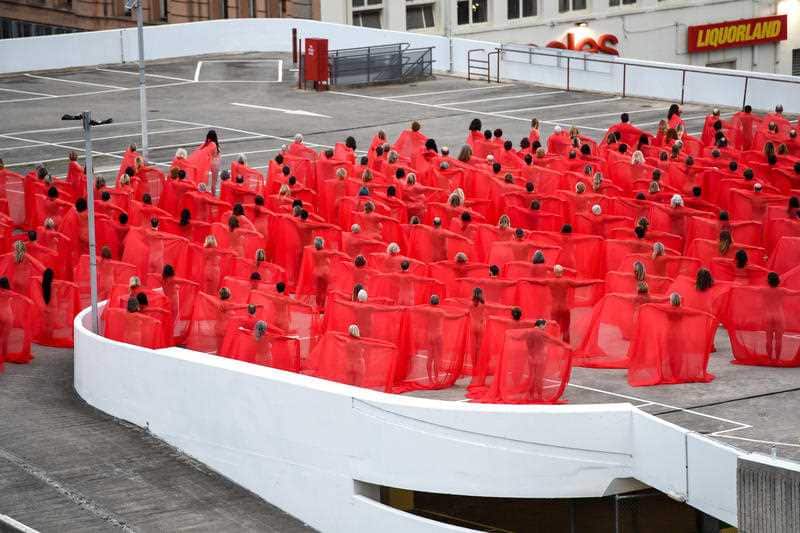 The chilly morning didn't stop people baring all for the artist.