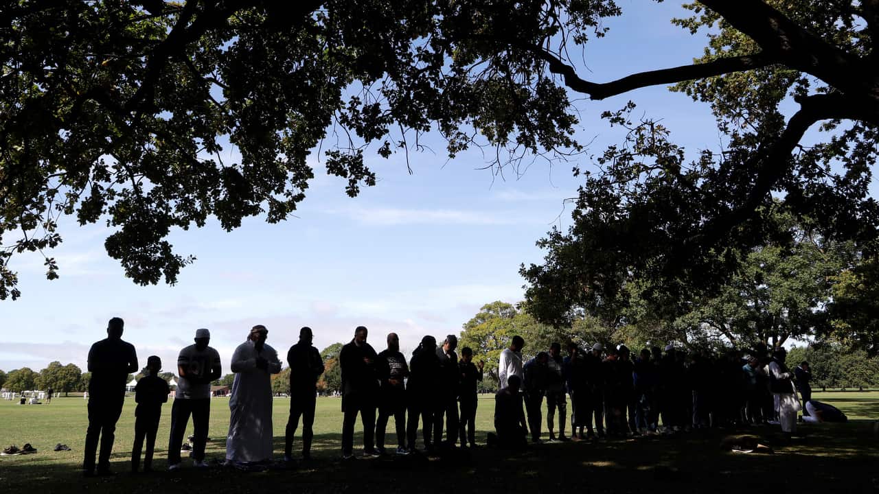 Muslim men pray in Hagley Park across the road from the Al Noor mosque following last weeks mass shooting in Christchurch.