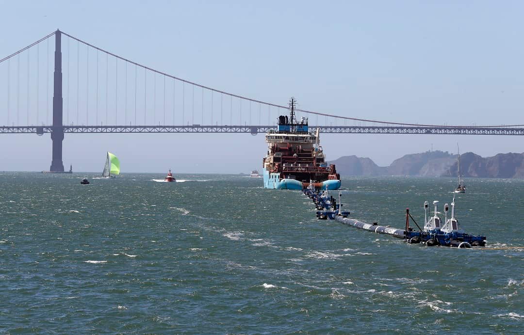 The Ocean Cleanup system is towed through the San Francisco Bay towards the Great Pacific Garbage Patch. 