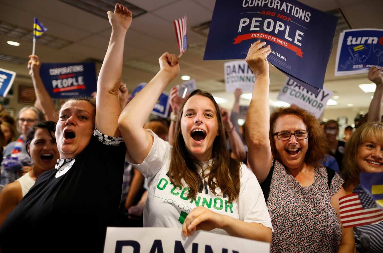 Supporters of Danny O'Connor, the Franklin County recorder, cheer during an election night watch party at the Ohio Civil Service Employees Association