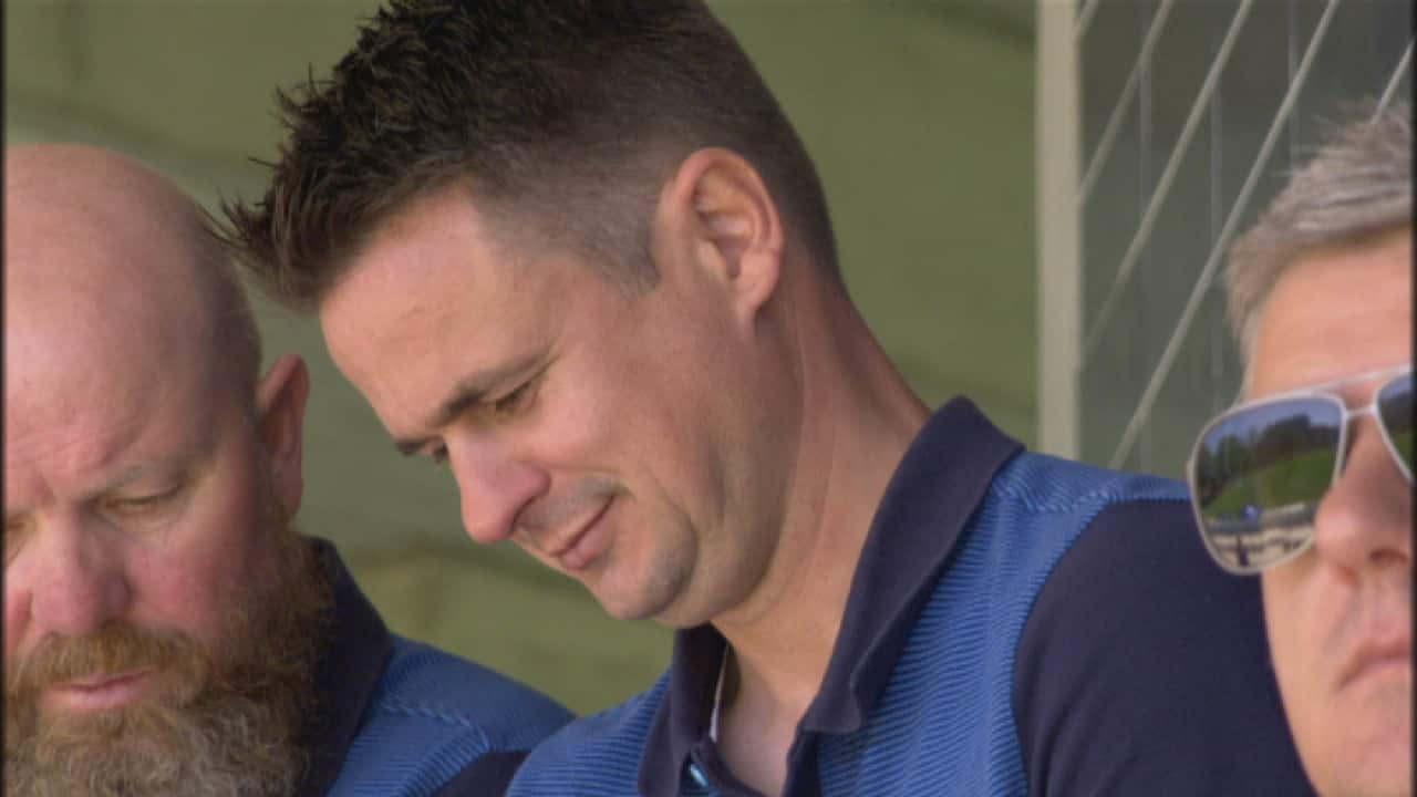 Australia Pararoos coach Kai Lammert looks at his notes while he watches the action at the 7-a-side football National Championships in Western Sydney