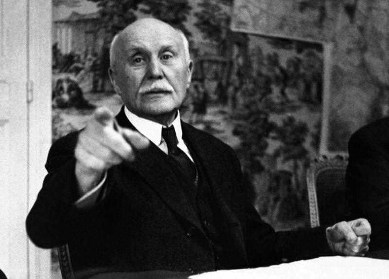 In this 1941file photo Marshal Philippe Petain orders a photographer out of a meeting in Vichy France.