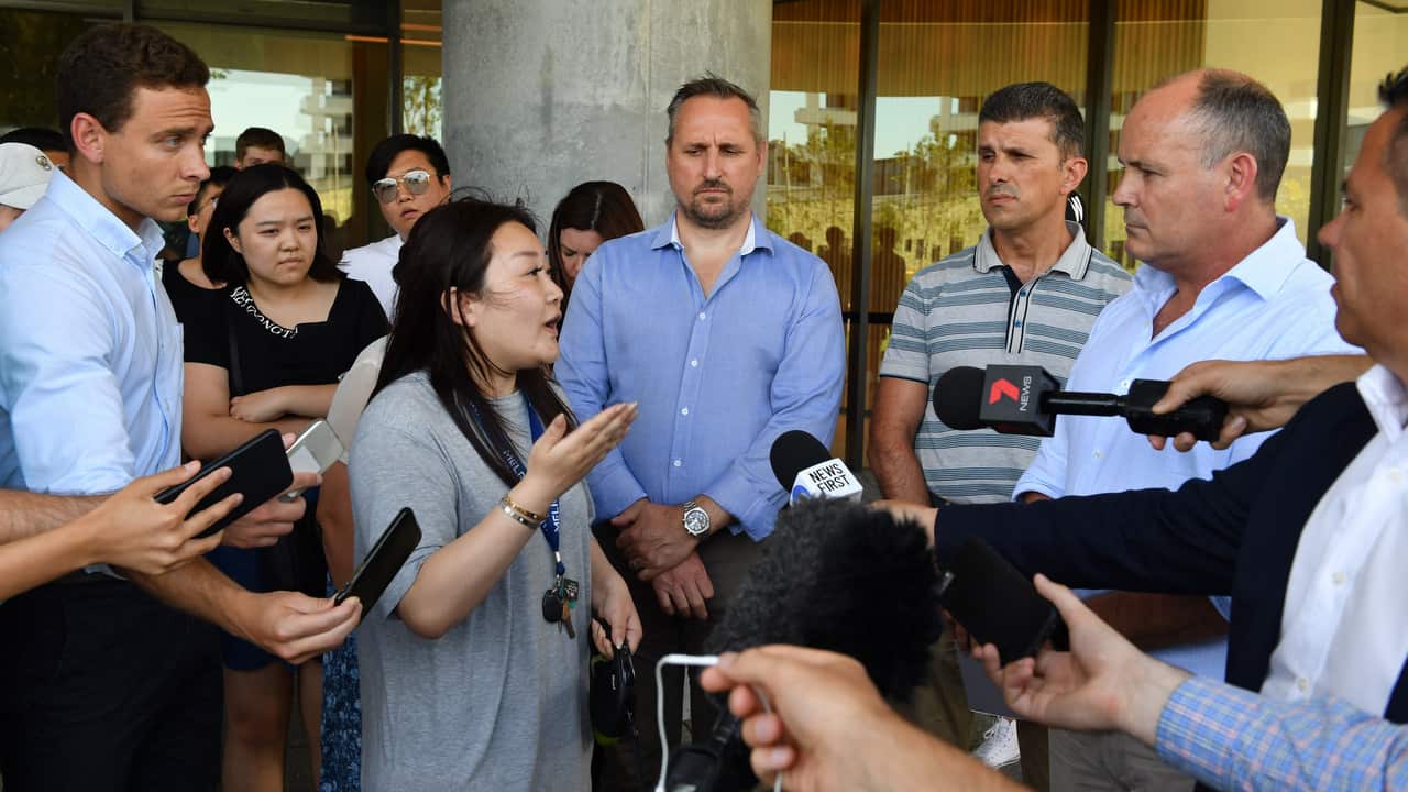 A resident asks questions of Icon Managing Director Julian Doyle at a press conference on 26/12/18.