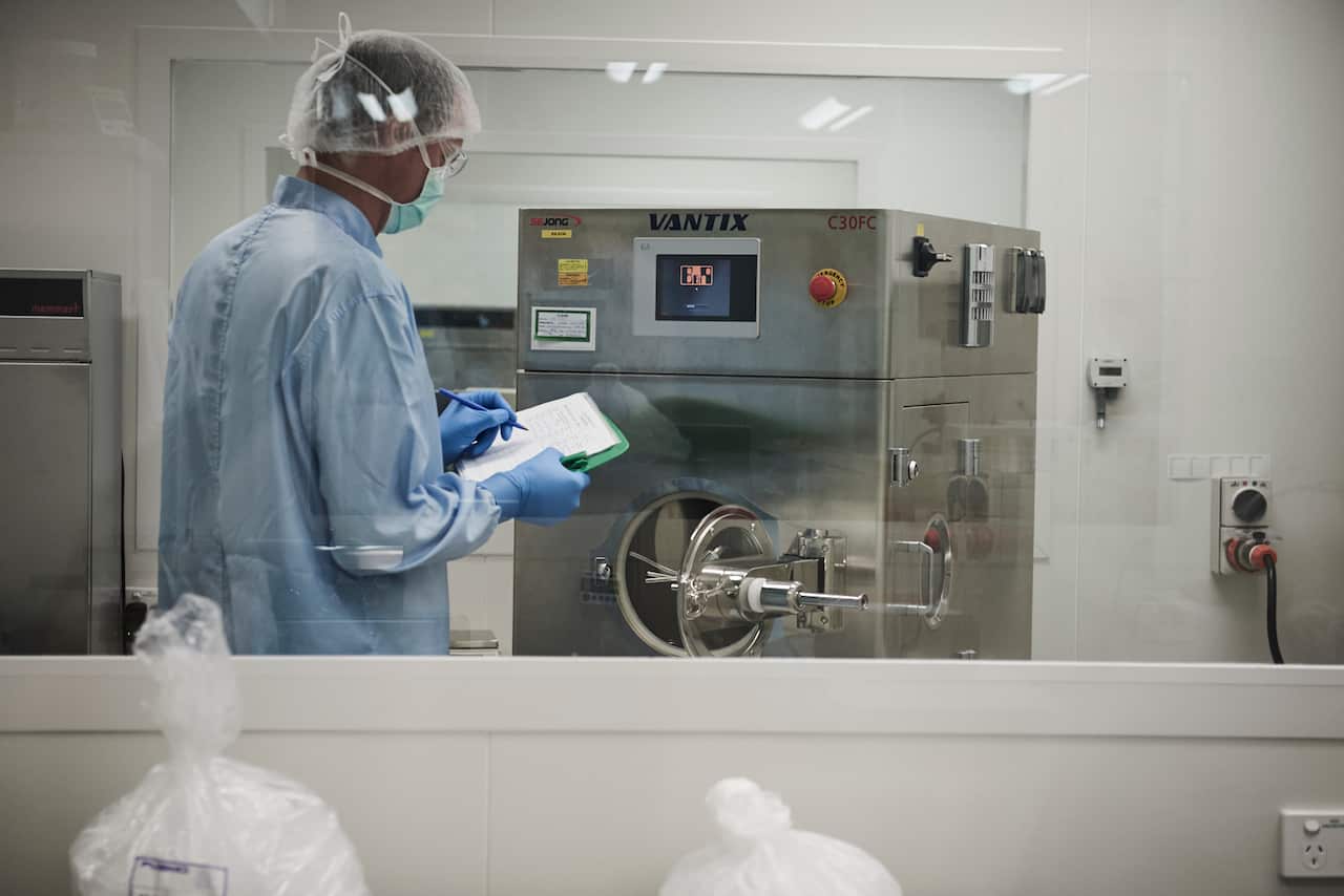 Matthew Foster, a production manager at Dr. O’Neil’s Go Medical Industries lab, reviewing the results of a machine that spray-coats naltrexone tablets. Naltrexone works by blocking receptors in the brain that deliver a high from opioids