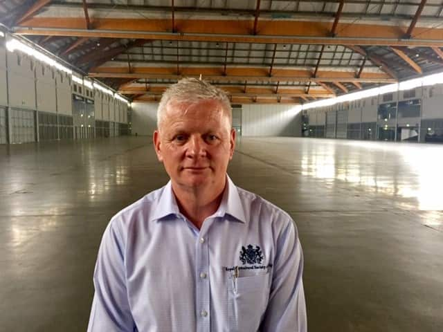 Paul Bowd from RAS in an empty showground pavillion.