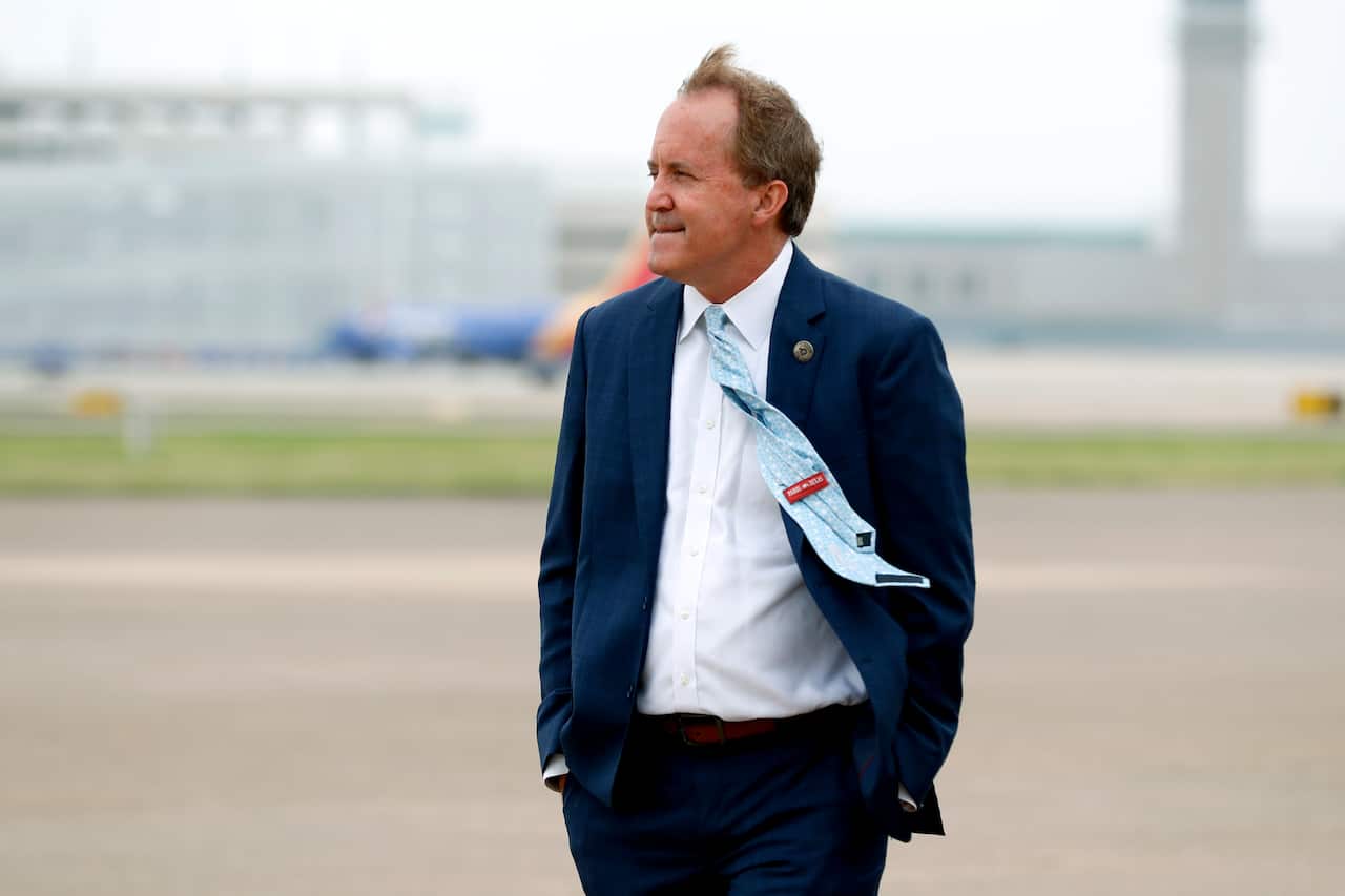 Texas' Attorney General Ken Paxton waits on the flight line for the arrival of Vice President Mike Pence at Love Field in Dallas, Texas.