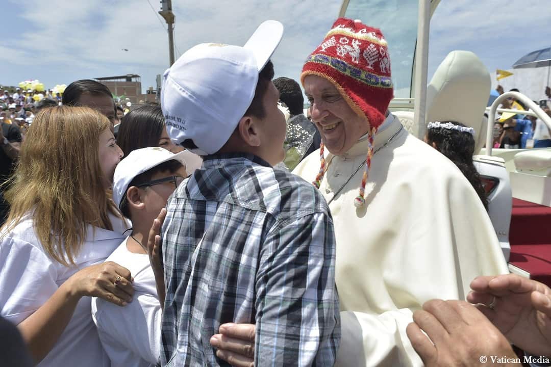 Pope Francis wears a woollen hat traditionally worn by Peru's Indigenous peoples.