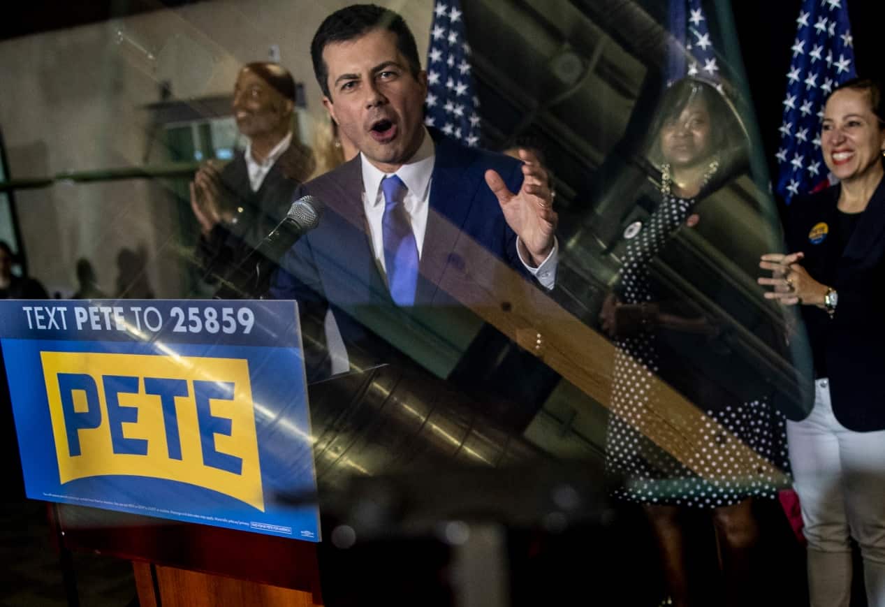 A TV Screen shows Former Mayor of South Bend, Pete Buttigieg, addressing supporters as results from the Nevada caucuses are reported