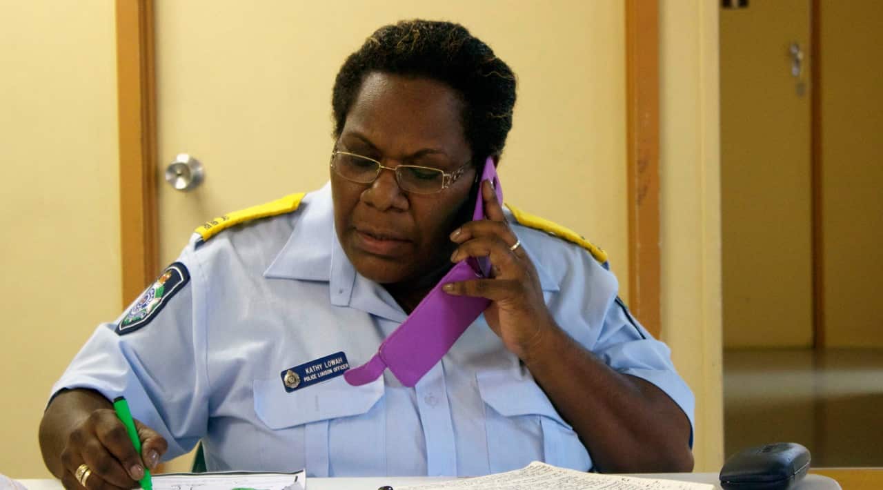 Indigenous Police Liaison Officer Kathy Lowah organises logistics at the Manoora Community Centre in Cairns on Thursday ahead of Saturday’s memorial service in Cairns.