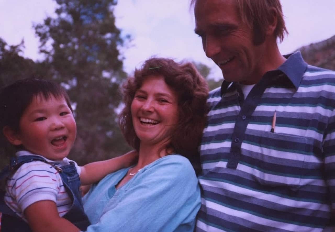 Toby Dawson with his adoptive parents, MIke and Deborah Dawson.