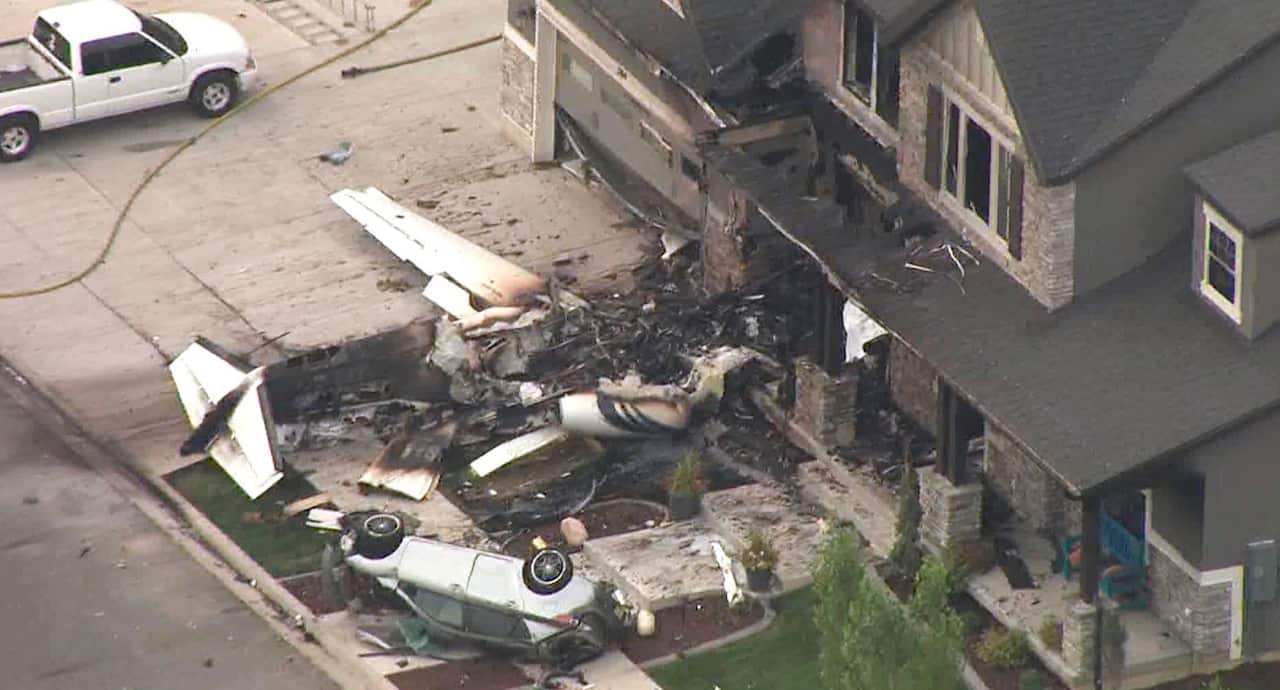 This frame from video shows the scene of a small plane that crashed into a house in Payson, Utah, on Monday, Aug 13.