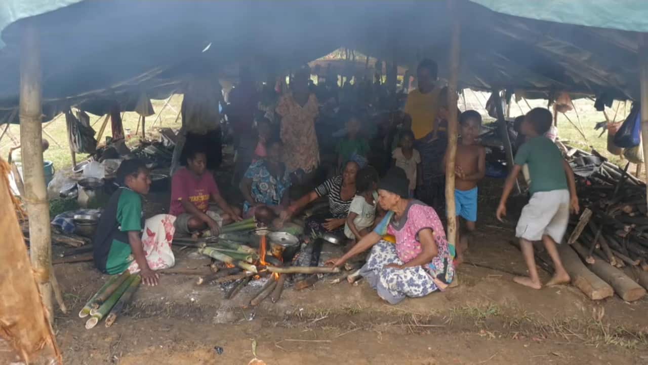 Earthquake survivors in emergency shelters