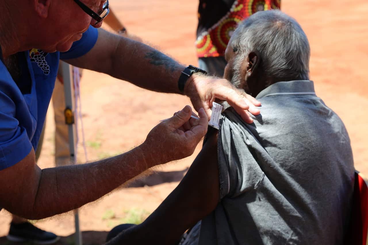 A man receives a coronavirus vaccine in the remote Aboriginal community of Beagle Bay, WA 