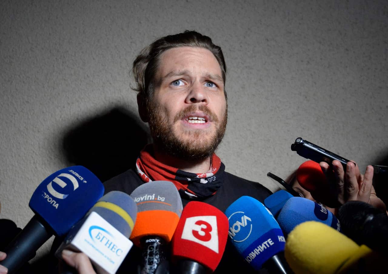 Jock Palfreeman speaks to journalists as he leaves migrants' detention centre in Busmantsi, Bulgaria