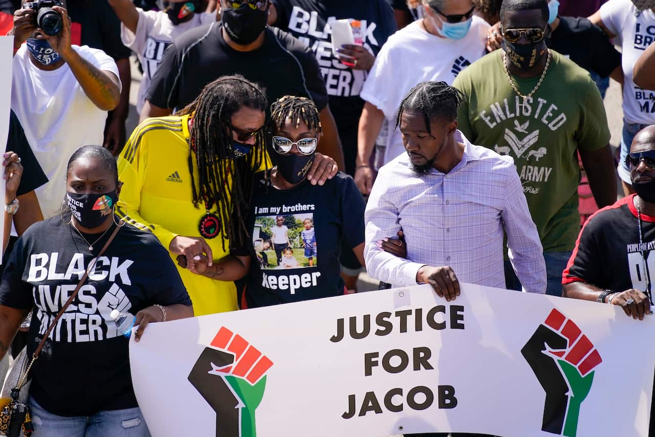 Jacob Blake’s family leads an anti-violence march.