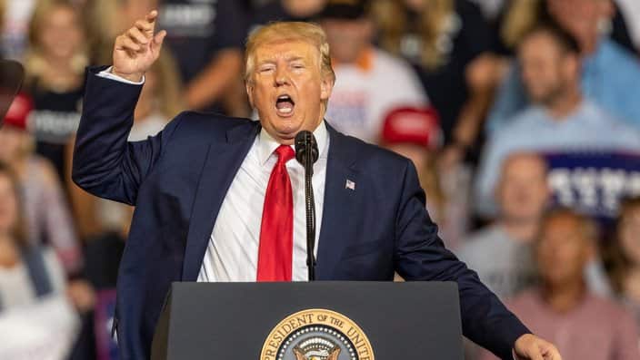 President Donald Trump works the crowd during a campaign rally in North Carolina.