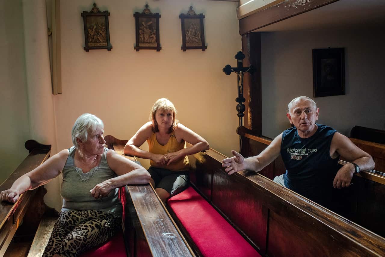 Irena Kubas Zareba, Eryka Blana, and Jozef Sluga, residents of the village of Miejsce Odrzanskie, Poland, Aug. 1, 2019. (Kasia Strek/The New York Times)