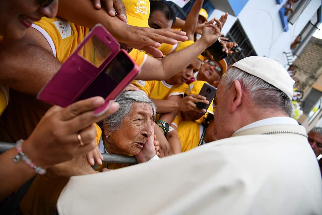 Pope Francis greets a woman at Plaza de Armas square in the Peruvian city of Trujillo.