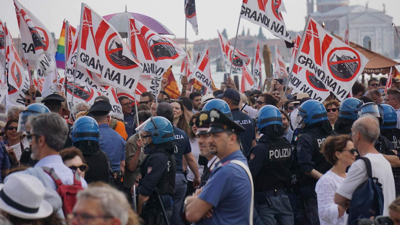 People gather during a demonstration against cruise ships being allowed in the Lagoon of Venice, Italy.