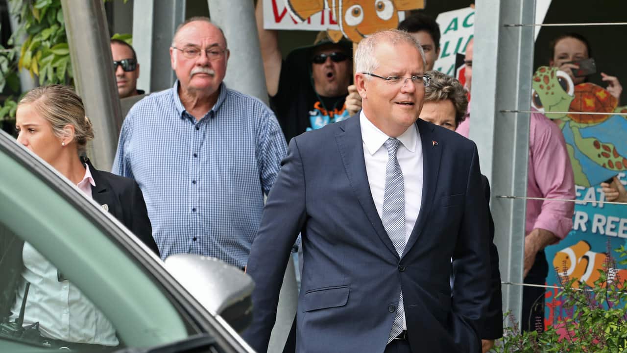 A small group of protesters greeted the Prime Minister Scott Morrison during a visit to the Australian Institute of Tropical Health on 21/1/19.