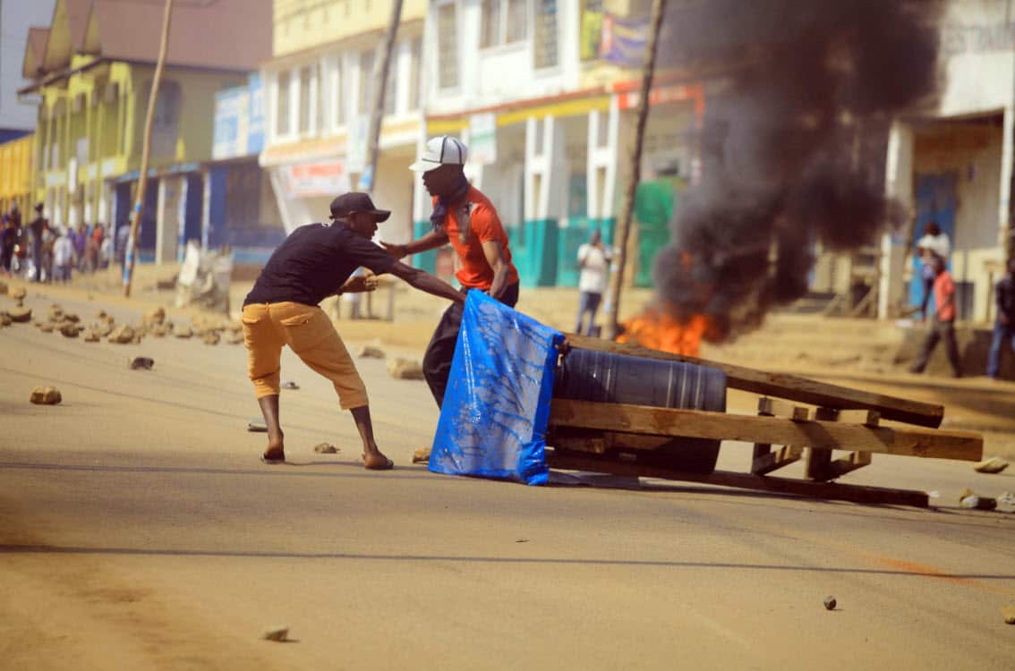 Protesters set up a barricade in the Eastern Congolese town of Beni Thursday Dec. 27, 2018 (AAP)